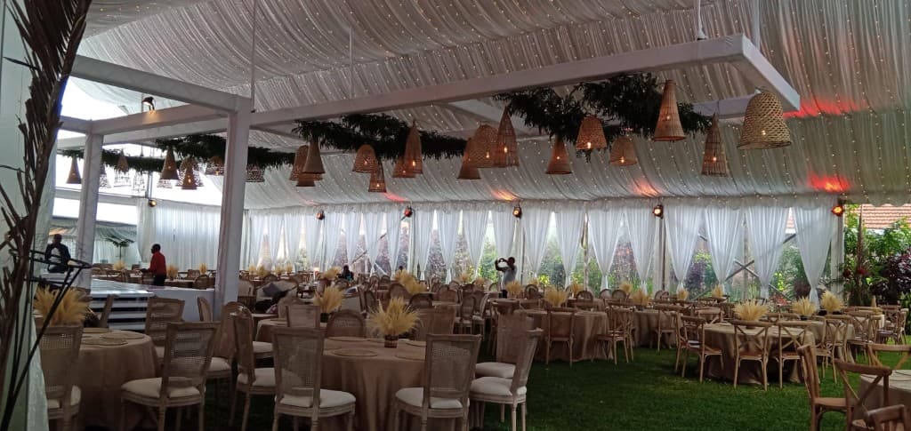 Marit Events pavilion reception with woven lighting and draped ceiling